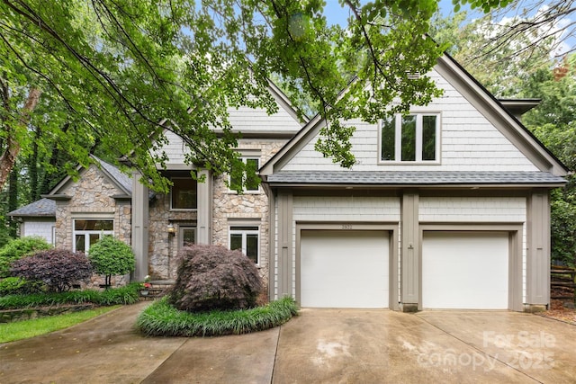 3932 Rounding Run Rd, Charlotte, NC 28277 - view of front facade with driveway, stone siding, an attached garage, and roof with shingles