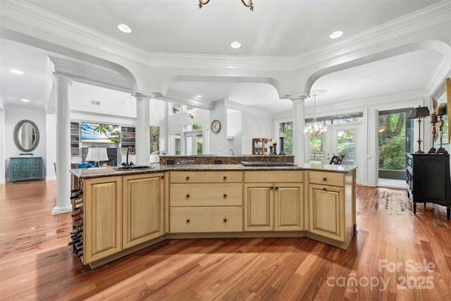3932 Rounding Run Rd, Charlotte, NC 28277 - kitchen with decorative columns, light wood-type flooring, a sink, healthy amount of natural light, and ornamental molding