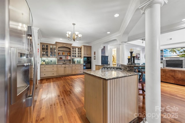 3932 Rounding Run Rd, Charlotte, NC 28277 - kitchen with ornate columns, appliances with stainless steel finishes, crown molding, open shelves, and light wood-style floors