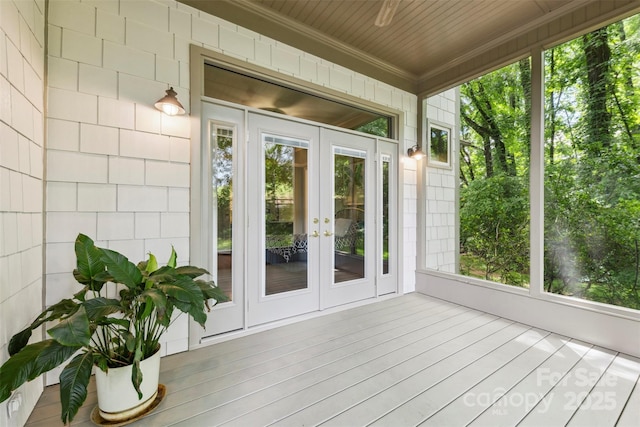 3932 Rounding Run Rd, Charlotte, NC 28277 - unfurnished sunroom featuring french doors, crown molding, plenty of natural light, and wood finished floors