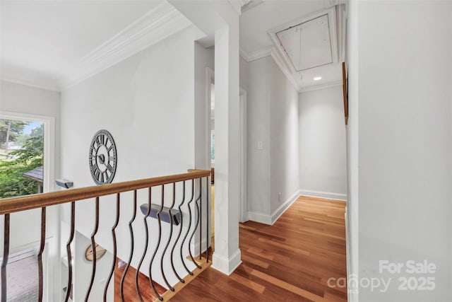 3932 Rounding Run Rd, Charlotte, NC 28277 - hall with attic access, ornamental molding, baseboards, wood finished floors, and an upstairs landing