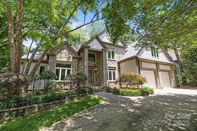 3932 Rounding Run Rd, Charlotte, NC 28277 - view of front of home featuring stone siding, concrete driveway, and a garage