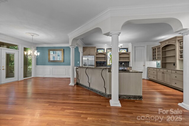 3932 Rounding Run Rd, Charlotte, NC 28277 - kitchen with open shelves, stainless steel refrigerator with ice dispenser, ornate columns, wood finished floors, and ornamental molding