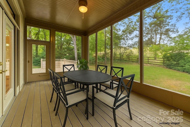 3932 Rounding Run Rd, Charlotte, NC 28277 - sunroom / solarium featuring outdoor dining area, a ceiling fan, and plenty of natural light