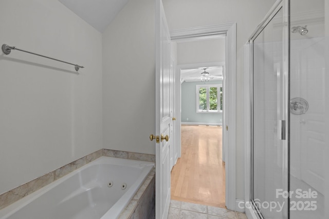 3932 Rounding Run Rd, Charlotte, NC 28277 - bathroom featuring a shower stall, a whirlpool tub, vaulted ceiling, and tile patterned flooring