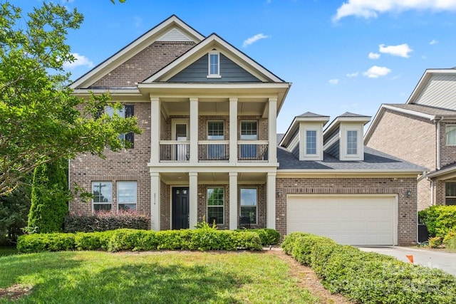 8514 Ellington Park Dr, Charlotte, NC 28277 - view of front facade with a balcony, brick siding, driveway, and an attached garage