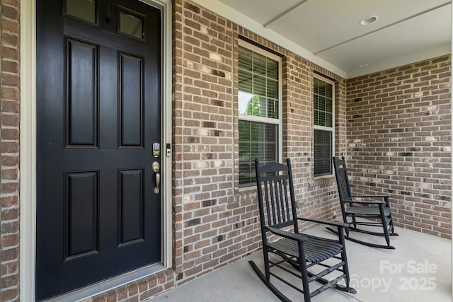 8514 Ellington Park Dr, Charlotte, NC 28277 - view of exterior entry with covered porch and brick siding