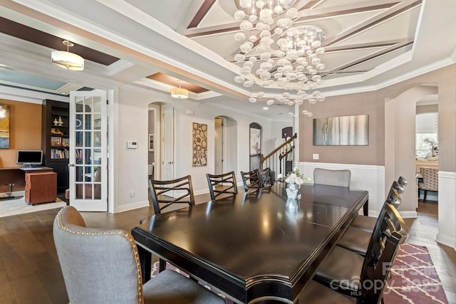 8514 Ellington Park Dr, Charlotte, NC 28277 - dining room featuring arched walkways, coffered ceiling, ornamental molding, wood finished floors, and a chandelier