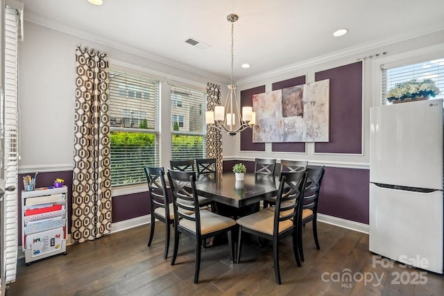 8514 Ellington Park Dr, Charlotte, NC 28277 - dining space featuring a chandelier, baseboards, ornamental molding, wood finished floors, and recessed lighting