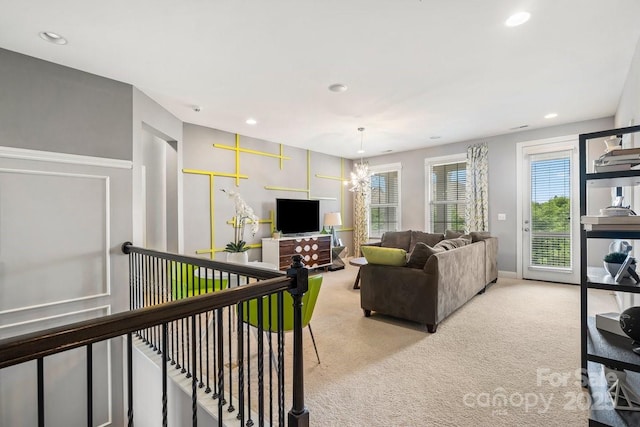 8514 Ellington Park Dr, Charlotte, NC 28277 - living room featuring light carpet, recessed lighting, and a chandelier