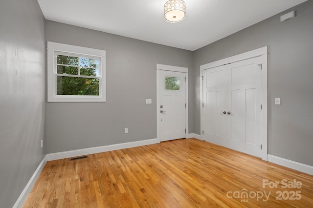 200 N Skyloft Dr Unit 2, Asheville, NC 28801 - entryway with healthy amount of natural light, light wood-style flooring, and baseboards