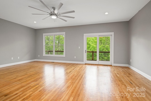200 N Skyloft Dr Unit 2, Asheville, NC 28801 - empty room with healthy amount of natural light, baseboards, ceiling fan, light wood-style flooring, and recessed lighting