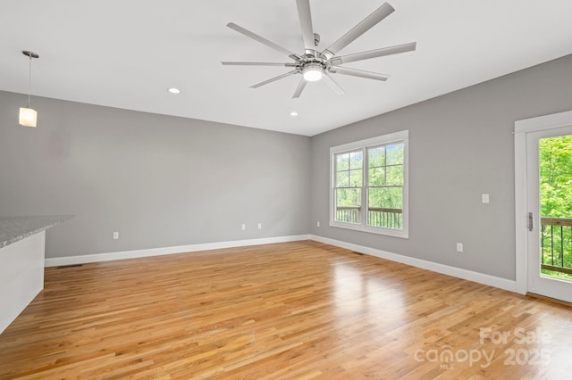200 N Skyloft Dr Unit 2, Asheville, NC 28801 - unfurnished living room featuring light wood-style floors, baseboards, recessed lighting, and a ceiling fan