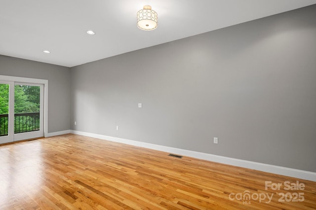 200 N Skyloft Dr Unit 2, Asheville, NC 28801 - spare room featuring light wood-style flooring, baseboards, and recessed lighting