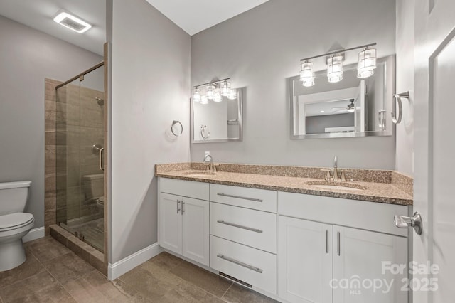 200 N Skyloft Dr Unit 2, Asheville, NC 28801 - bathroom with toilet, a shower stall, baseboards, and double vanity