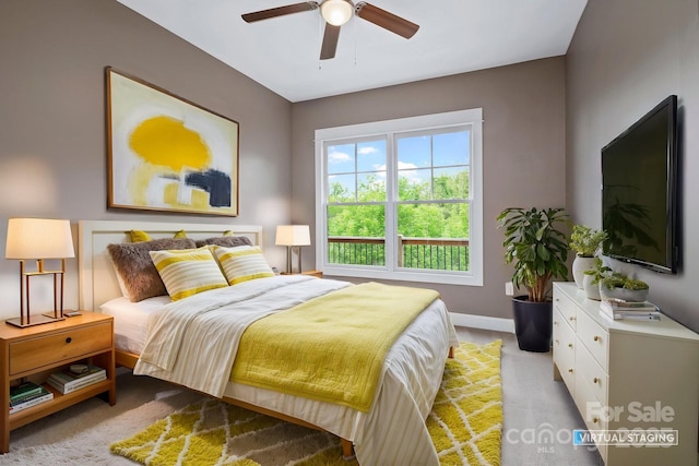 200 N Skyloft Dr Unit 2, Asheville, NC 28801 - bedroom with baseboards, light colored carpet, and a ceiling fan
