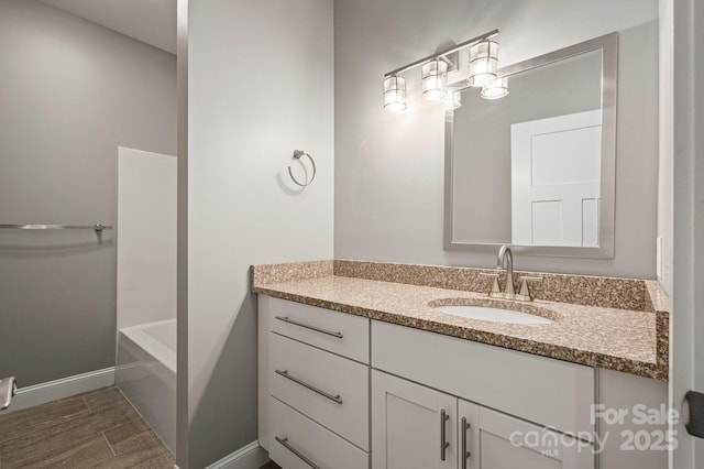 200 N Skyloft Dr Unit 2, Asheville, NC 28801 - full bath with vanity, wood finished floors, baseboards, and a bath