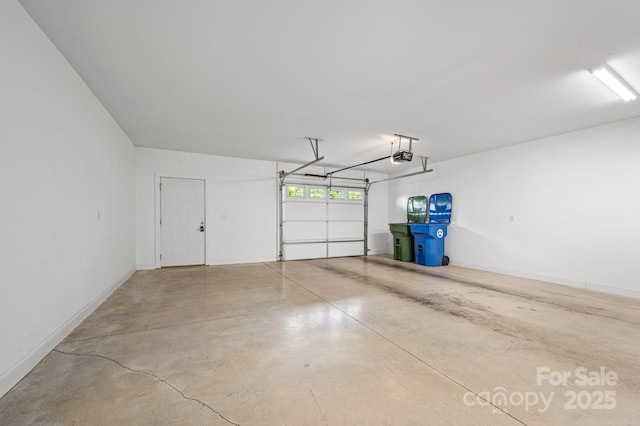 200 N Skyloft Dr Unit 2, Asheville, NC 28801 - garage with a garage door opener and baseboards