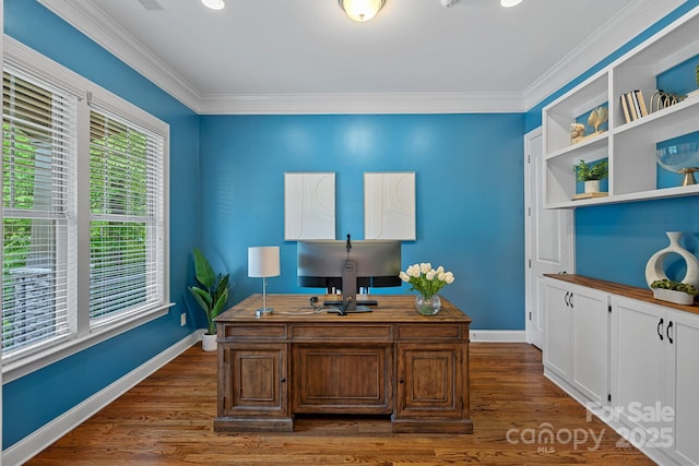 home office featuring baseboards, crown molding, and dark wood finished floors