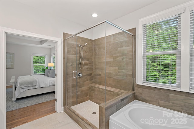 bathroom with a shower stall, connected bathroom, a bath, tile patterned floors, and recessed lighting