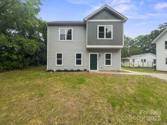 746 Shasta St NW, Concord, NC 28027 - view of front facade featuring a front lawn and board and batten siding
