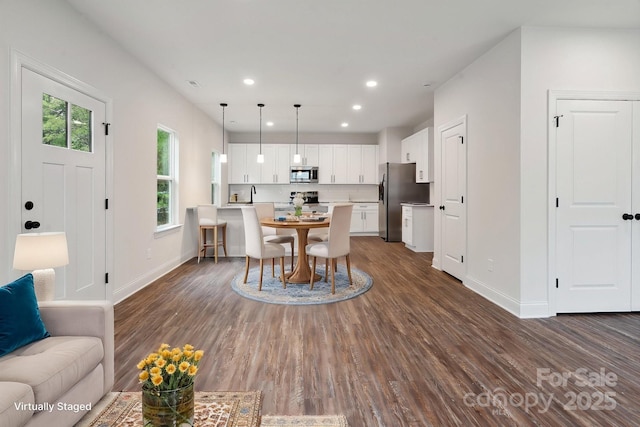 746 Shasta St NW, Concord, NC 28027 - dining room featuring dark wood-style floors, baseboards, and recessed lighting