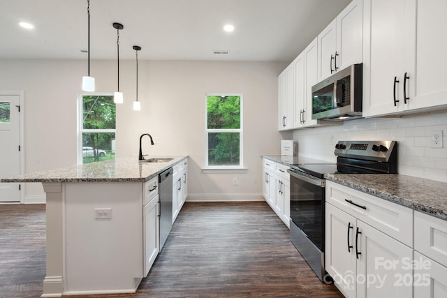 746 Shasta St NW, Concord, NC 28027 - kitchen with stainless steel appliances, a sink, dark wood-style floors, light stone countertops, and baseboards