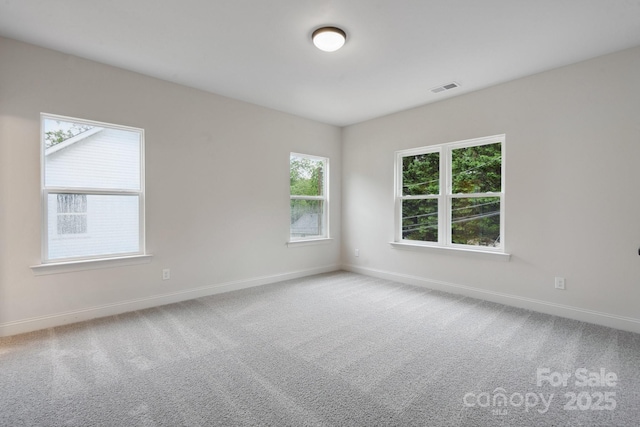 746 Shasta St NW, Concord, NC 28027 - carpeted empty room with baseboards