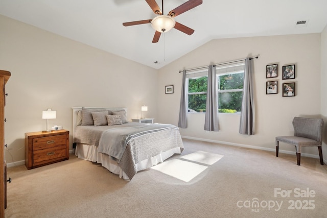 bedroom featuring lofted ceiling, light colored carpet, baseboards, and ceiling fan