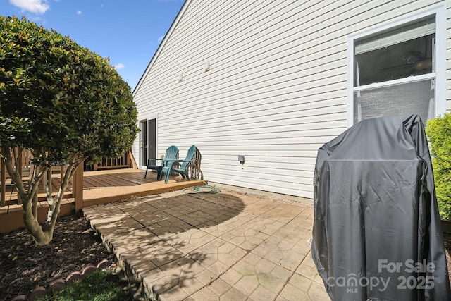 view of patio featuring a deck and area for grilling