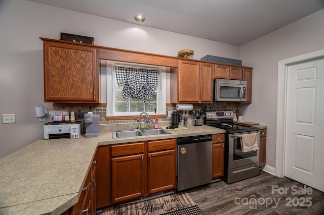167 Brown Watterson Rd, Cherryville, NC 28021 - kitchen featuring stainless steel appliances, a sink, light countertops, tasteful backsplash, and dark wood-style flooring