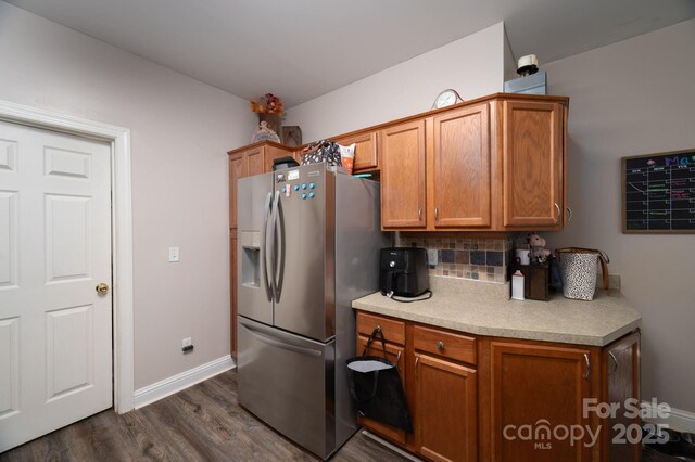167 Brown Watterson Rd, Cherryville, NC 28021 - kitchen with stainless steel fridge with ice dispenser, decorative backsplash, dark wood-style floors, light countertops, and brown cabinetry