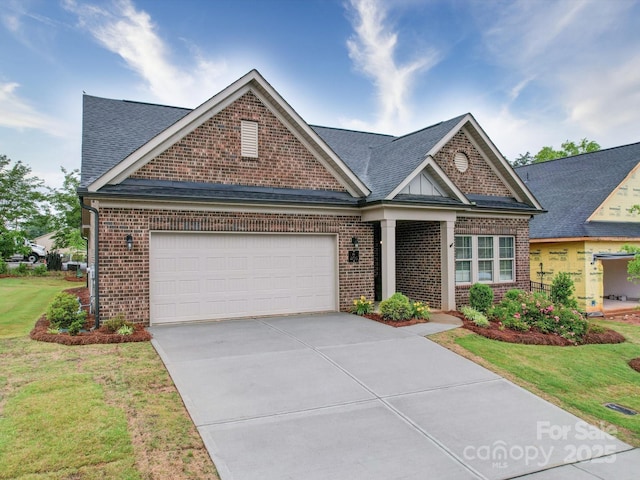 405 Newstyle Way, Gastonia, NC 28056 - view of front of home with brick siding, an attached garage, driveway, a shingled roof, and a front lawn