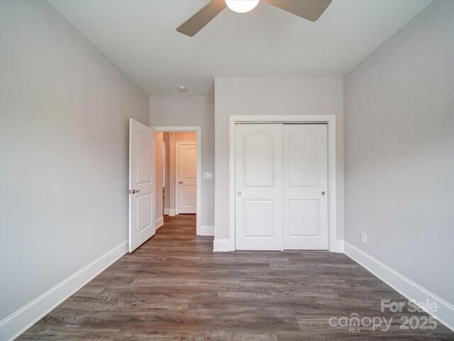 405 Newstyle Way, Gastonia, NC 28056 - unfurnished bedroom with baseboards, wood finished floors, a closet, and a ceiling fan