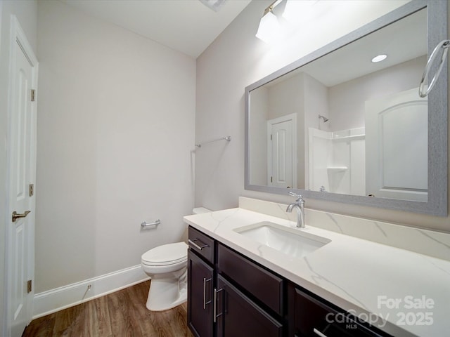 405 Newstyle Way, Gastonia, NC 28056 - full bath featuring wood finished floors, a shower, baseboards, vanity, and toilet