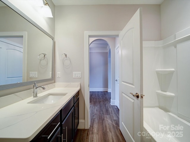 405 Newstyle Way, Gastonia, NC 28056 - full bath featuring wood finished floors, baseboards, vanity, and washtub / shower combination