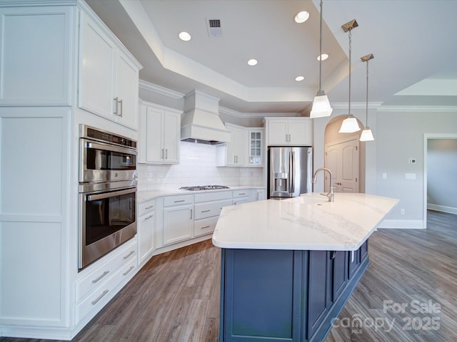405 Newstyle Way, Gastonia, NC 28056 - kitchen featuring custom exhaust hood, appliances with stainless steel finishes, a raised ceiling, dark wood-type flooring, and ornamental molding