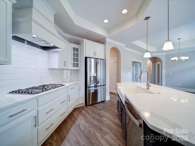 405 Newstyle Way, Gastonia, NC 28056 - kitchen with stainless steel appliances, arched walkways, a raised ceiling, custom range hood, and a sink