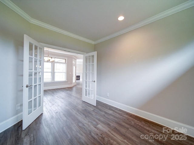 405 Newstyle Way, Gastonia, NC 28056 - empty room featuring french doors, baseboards, ornamental molding, dark wood-style floors, and a chandelier