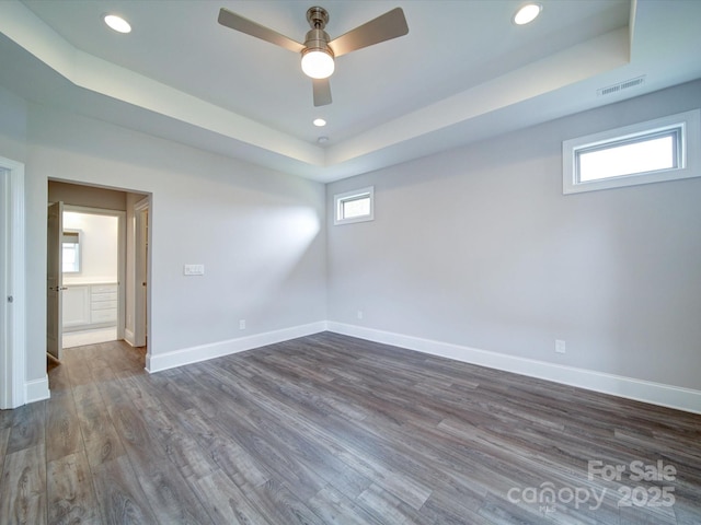 405 Newstyle Way, Gastonia, NC 28056 - empty room featuring a raised ceiling, a ceiling fan, dark wood-style floors, recessed lighting, and baseboards