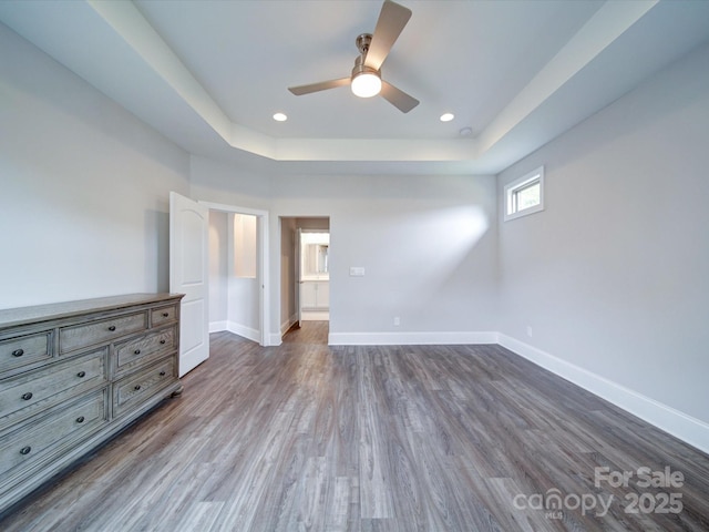 405 Newstyle Way, Gastonia, NC 28056 - unfurnished bedroom with dark wood finished floors, a raised ceiling, baseboards, recessed lighting, and a ceiling fan