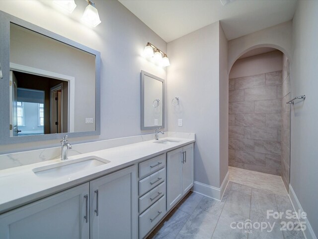 405 Newstyle Way, Gastonia, NC 28056 - full bath with baseboards, marble look tile flooring, double vanity, and tiled shower