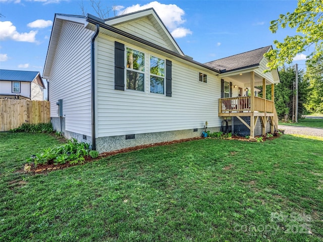 rear view of house featuring crawl space and stairway