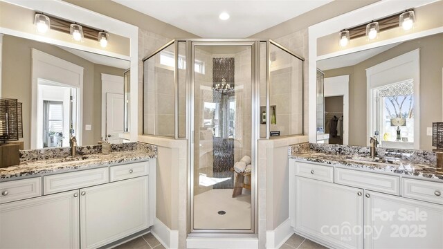 7324 Jolly Brook Dr, Charlotte, NC 28215 - full bath with a stall shower, plenty of natural light, and two vanities