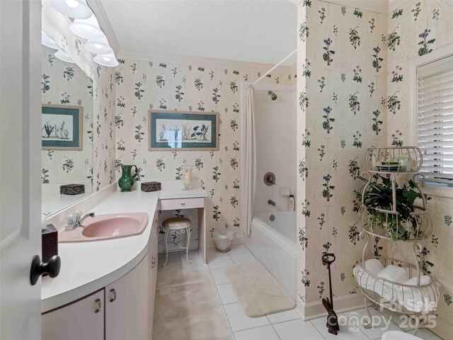 full bath with wallpapered walls, ornamental molding, vanity, tile patterned flooring, and shower / tub combination