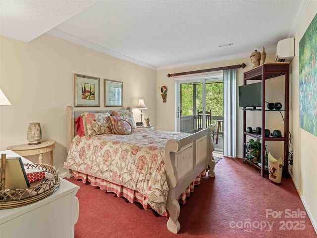 carpeted bedroom featuring access to exterior, a textured ceiling, a wall unit AC, and ornamental molding