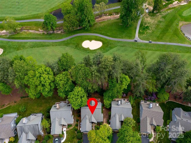 view of property location featuring nearby suburban area and a local golf course