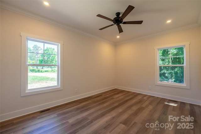 7426 Hambright Rd, Huntersville, NC 28078 - spare room featuring healthy amount of natural light, ornamental molding, dark wood finished floors, ceiling fan, and baseboards