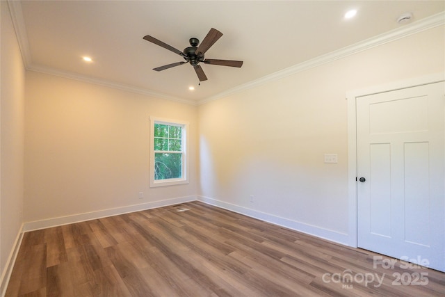 7426 Hambright Rd, Huntersville, NC 28078 - unfurnished room featuring a ceiling fan, wood finished floors, a smoke detector, ornamental molding, and baseboards