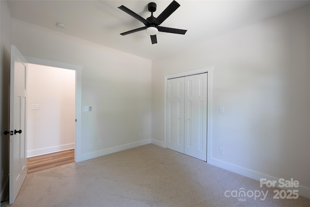 7426 Hambright Rd, Huntersville, NC 28078 - unfurnished bedroom featuring carpet, baseboards, a closet, and ceiling fan